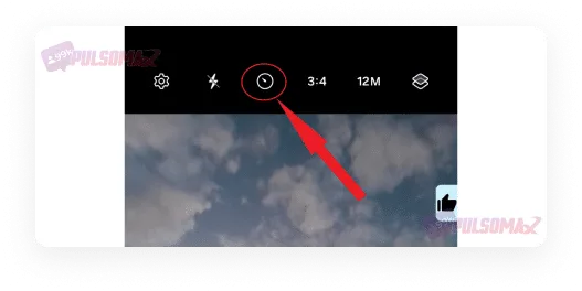 Timer button on the cell phone camera.
